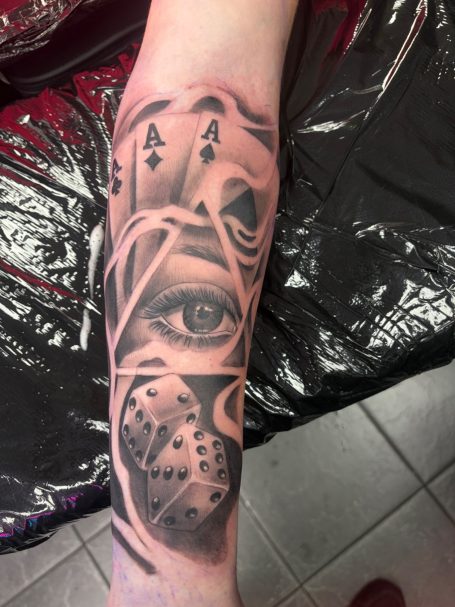 Black and grey gambling tattoo Warrington Black and grey gambling men’s tattoo