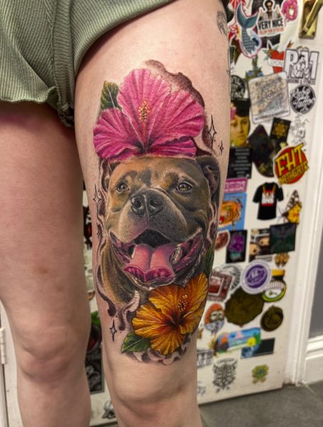 Realistic dog portrait with flowers Realistic colour portrait of dog . Colour realism tattoo . Colour portrait tattoo . Warrington